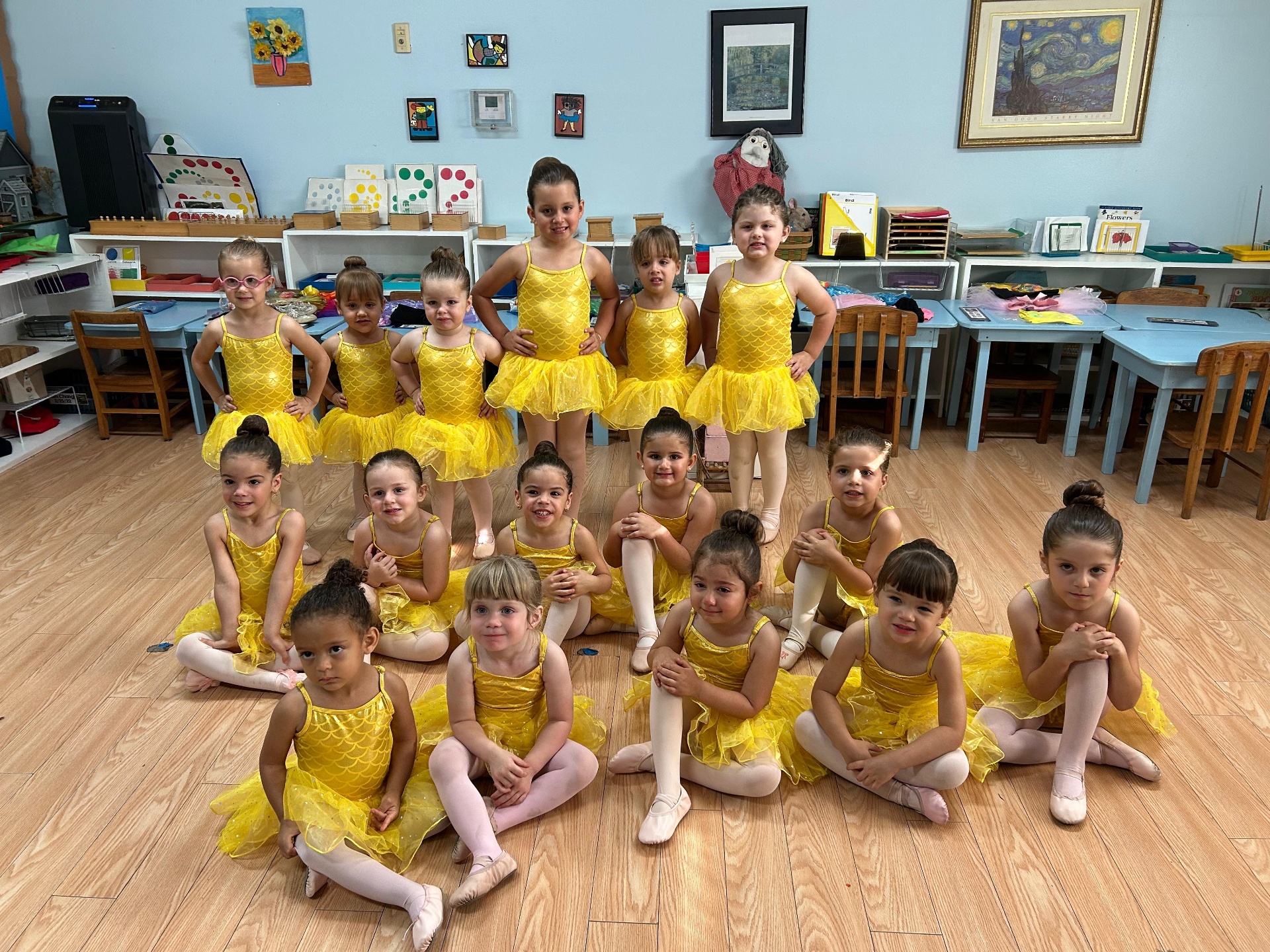 Little ballerinas on stage during end-of-year recital performance
